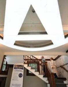 Steve Reymann and his sister, Margaret Reymann Skinner, give a tour of the remodeled Reymann family barn.
